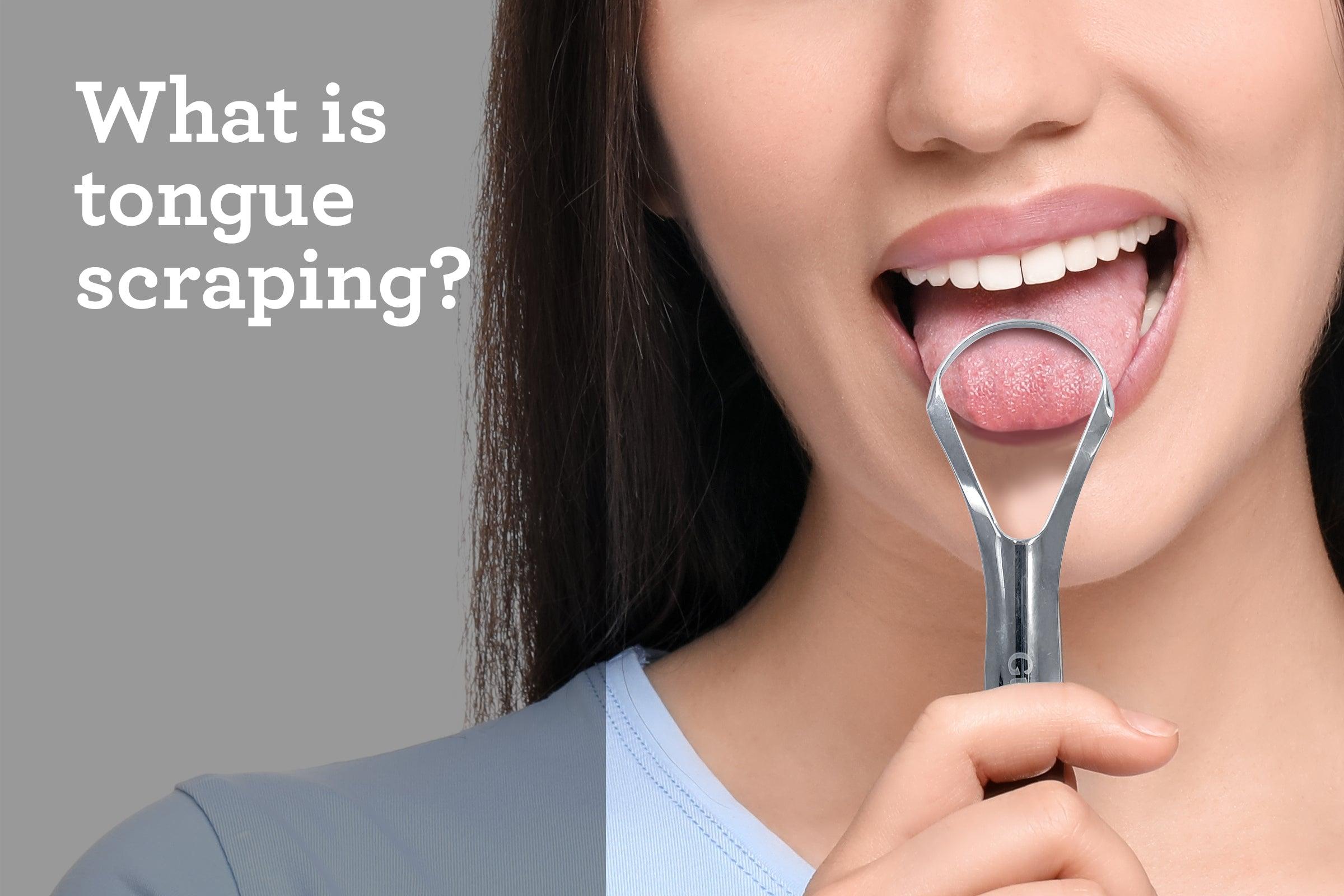 Demonstration of tongue scraping: person using a stainless steel U-shaped tongue scraper