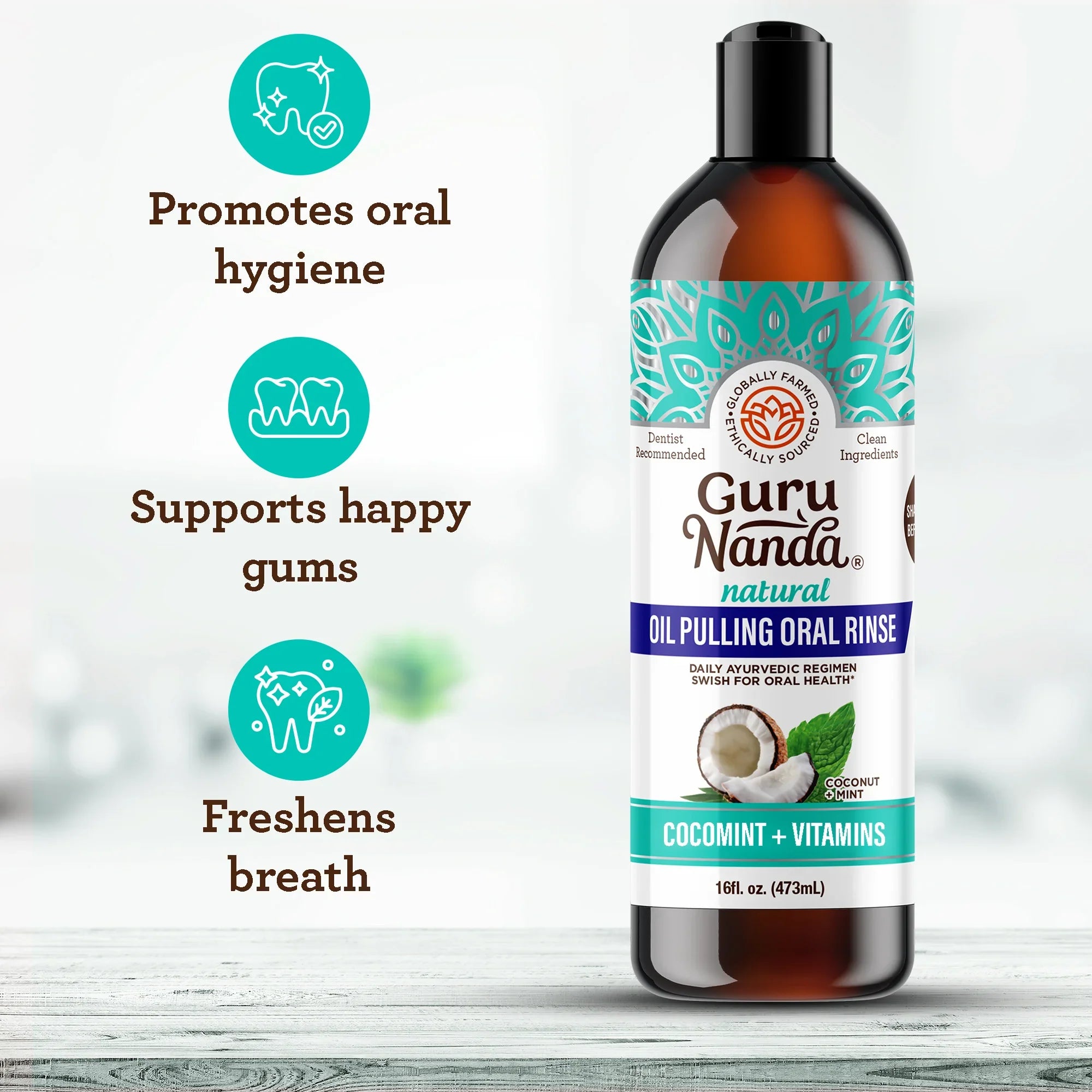Bottle of Guru Nanda oil pulling oral rinse with benefits listed on a light background