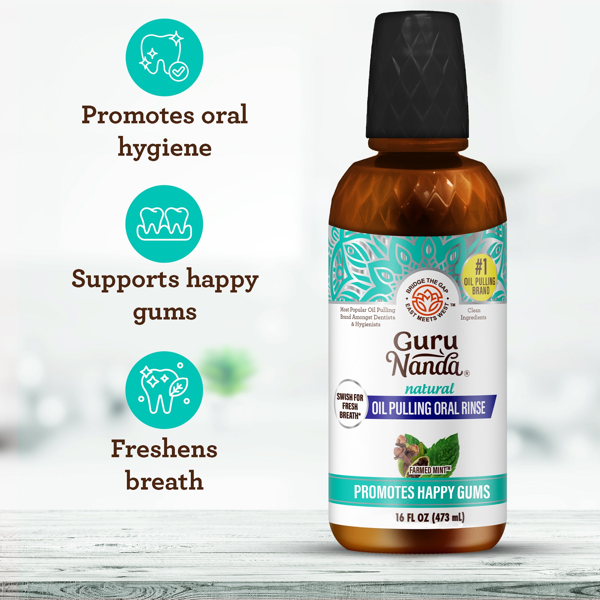 Bottle of Guru Nanda oil pulling oral rinse with features listed on a white background